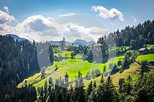 Church Cerkev Sveti Duh with mountain range KamnikÃ¢â¬âSavinja Alps